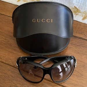 Gucci black sunglasses.  Good condition gold buckle in side